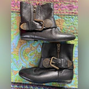 Black leather boots w/ black belt & gold colored buckle w/ decorative disk